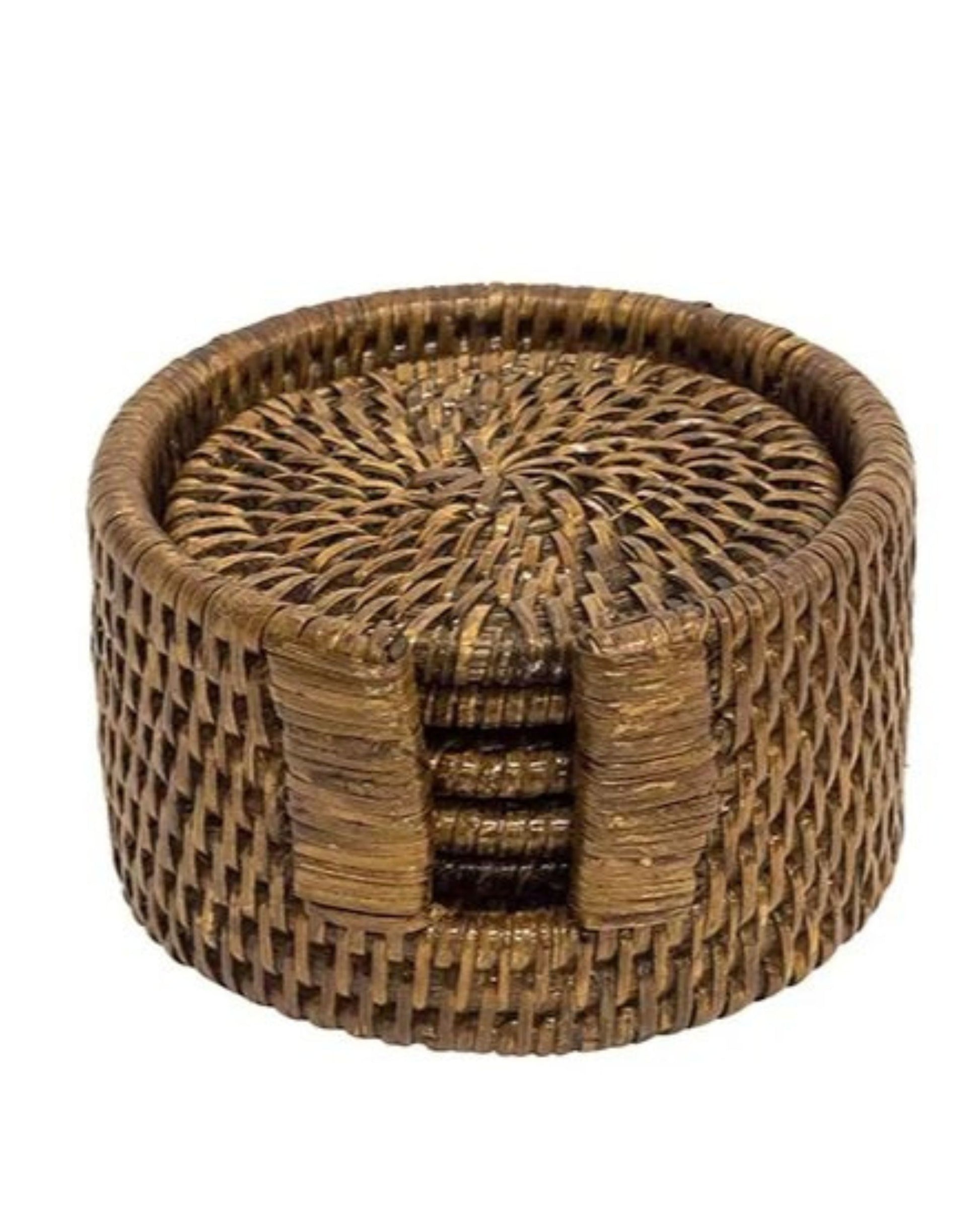 Add a rustic décor element to your table with the RATTAN COASTER SET by Le Monde, featuring a round design and an accompanying holder. Made from eco-friendly rattan, these coasters offer a textured surface and come with a holder designed for easy access.