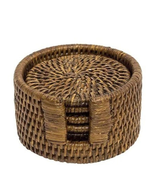 Add a rustic décor element to your table with the RATTAN COASTER SET by Le Monde, featuring a round design and an accompanying holder. Made from eco-friendly rattan, these coasters offer a textured surface and come with a holder designed for easy access.