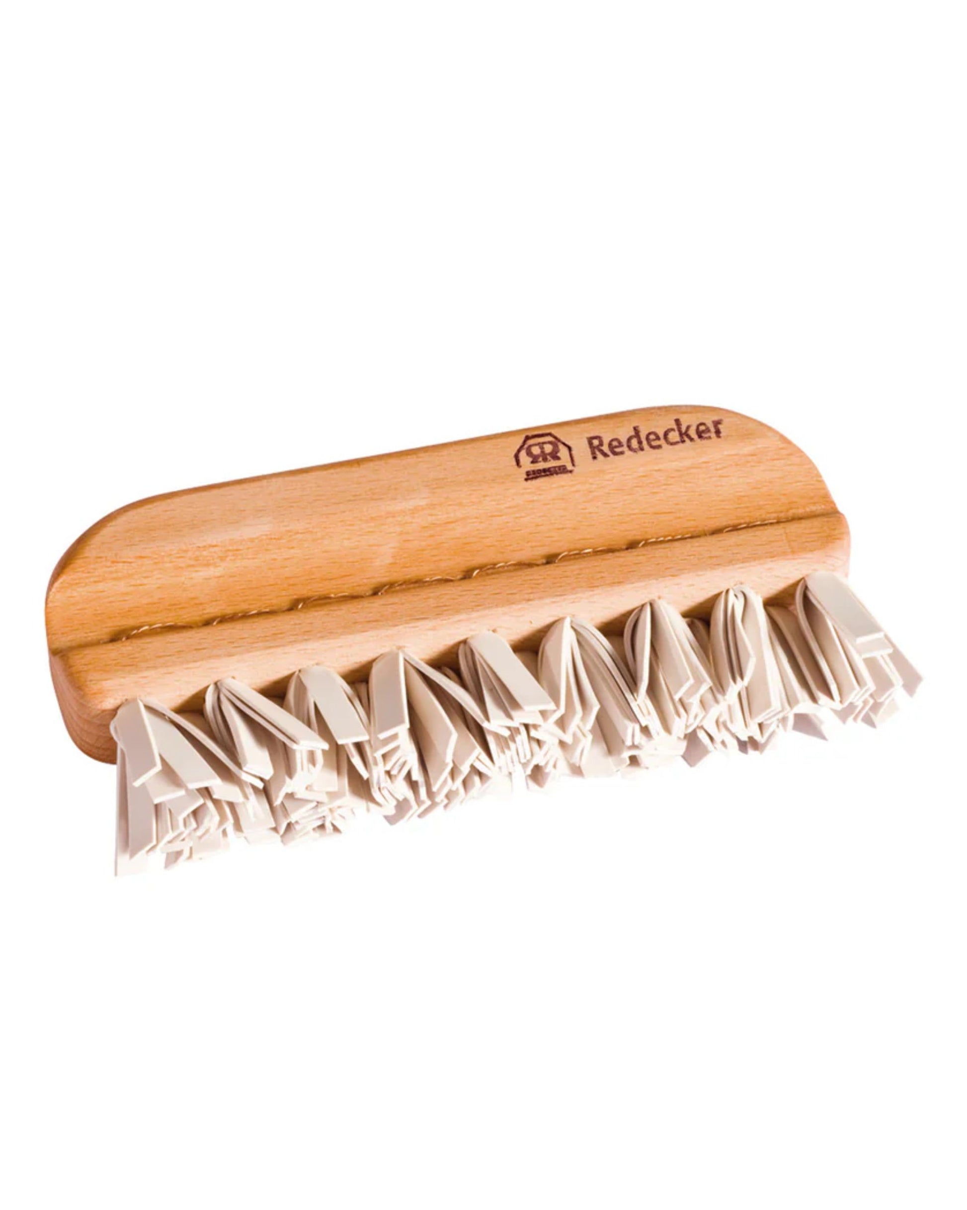 The LINT + PET BRUSH by Redecker is a wooden brush featuring a smooth handle engraved with the brand name. It has short, stiff bristles arranged in clusters, making it ideal for cleaning upholstery and removing animal hair.