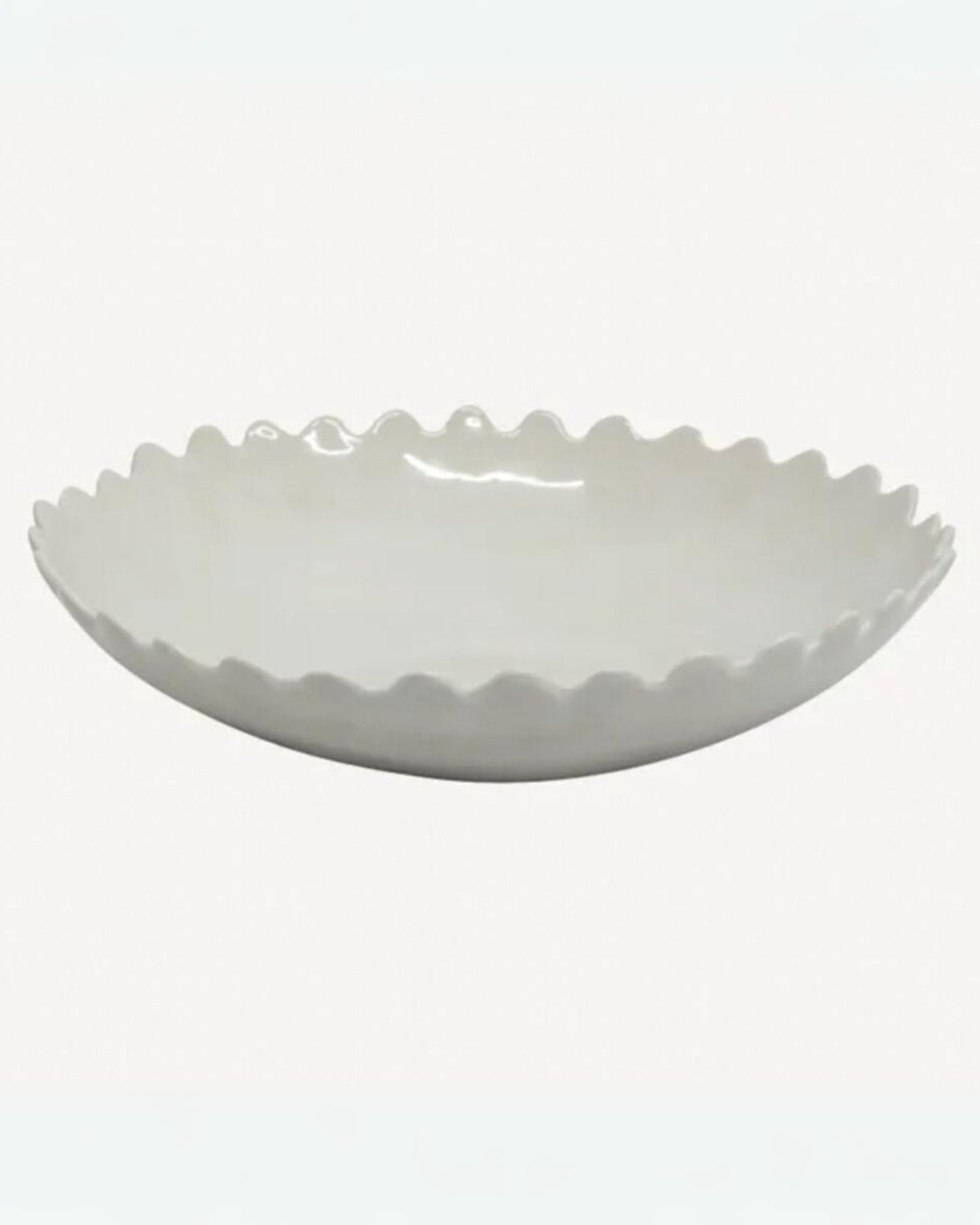 The PETAL SALAD BOWL by French Country, featuring a white ceramic finish with scalloped edges and an elegant petal design, rests on a plain background, making it perfect for any dining table setting.