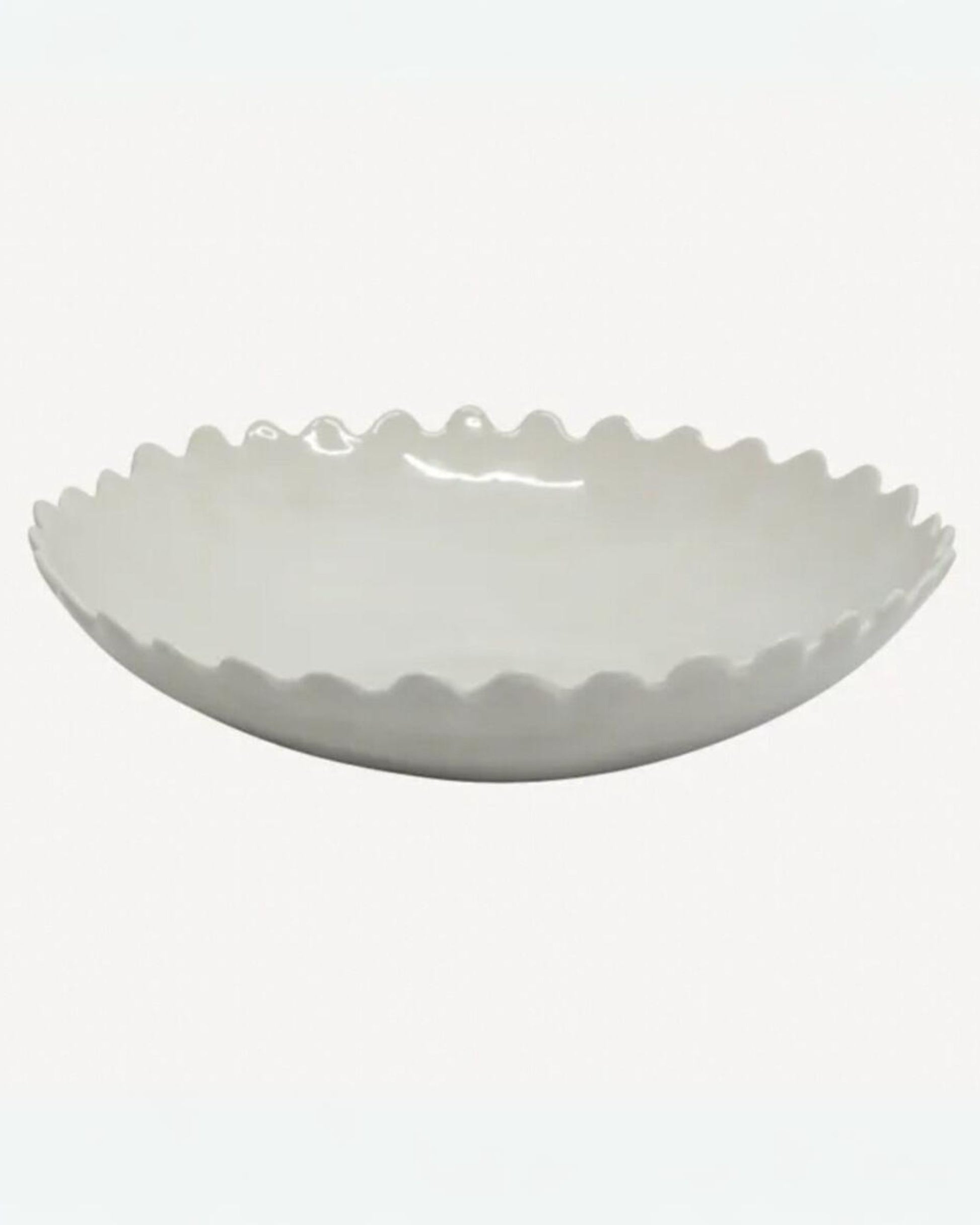 The PETAL SALAD BOWL by French Country, featuring a white ceramic finish with scalloped edges and an elegant petal design, rests on a plain background, making it perfect for any dining table setting.
