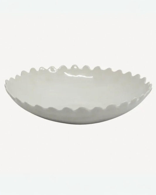 The PETAL SALAD BOWL by French Country, featuring a white ceramic finish with scalloped edges and an elegant petal design, rests on a plain background, making it perfect for any dining table setting.