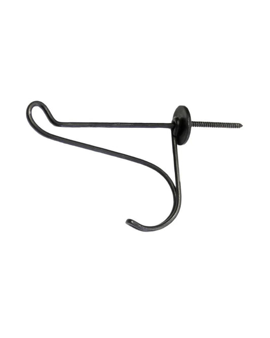 The Panama Hook by Society Ink is a blackened iron wall hook featuring an attached screw for mounting. With a design reminiscent of a French flea market find, it boasts a simple, curved silhouette with a circular base, seamlessly blending function and style in any room.