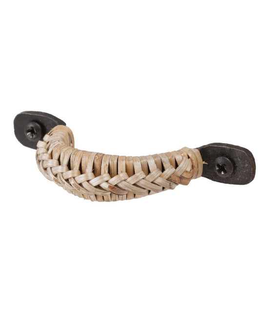 The TRADER DRAWER PULL by Society Ink elegantly combines mixed materials with its curved, woven rattan design attached to dark metal plates using screws on each end, making it ideal for enhancing standard cupboards.