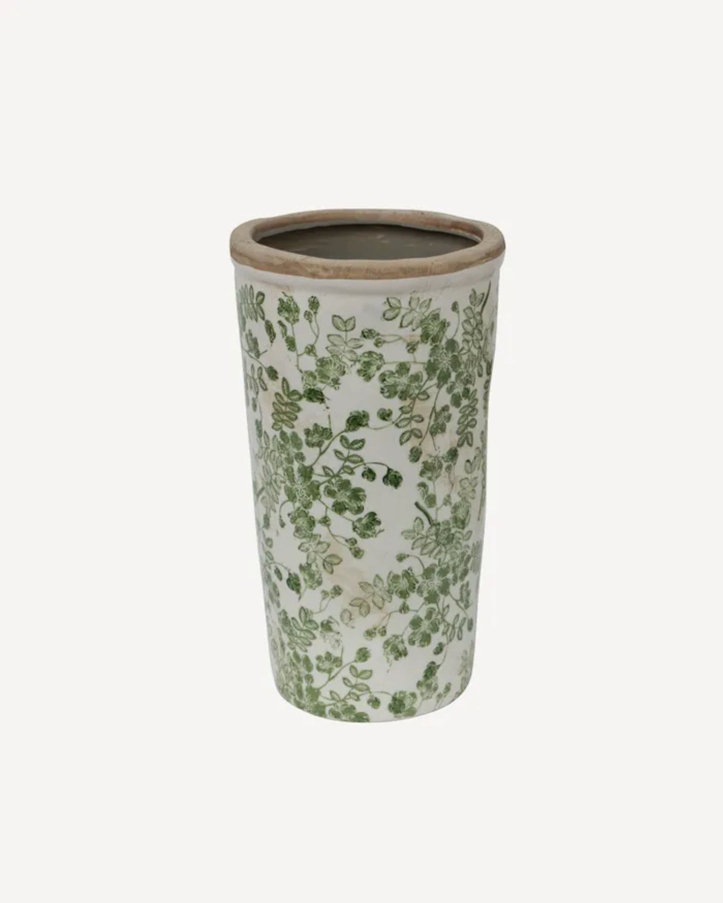 The BOTANICAL VASE - GREEN FLORAL by French Country showcases pastoral charm with its tall, cylindrical stoneware shape adorned with a green leaf design on a white background. Its rustic appearance, smooth surface, and open top infuse any room with countryside elegance.