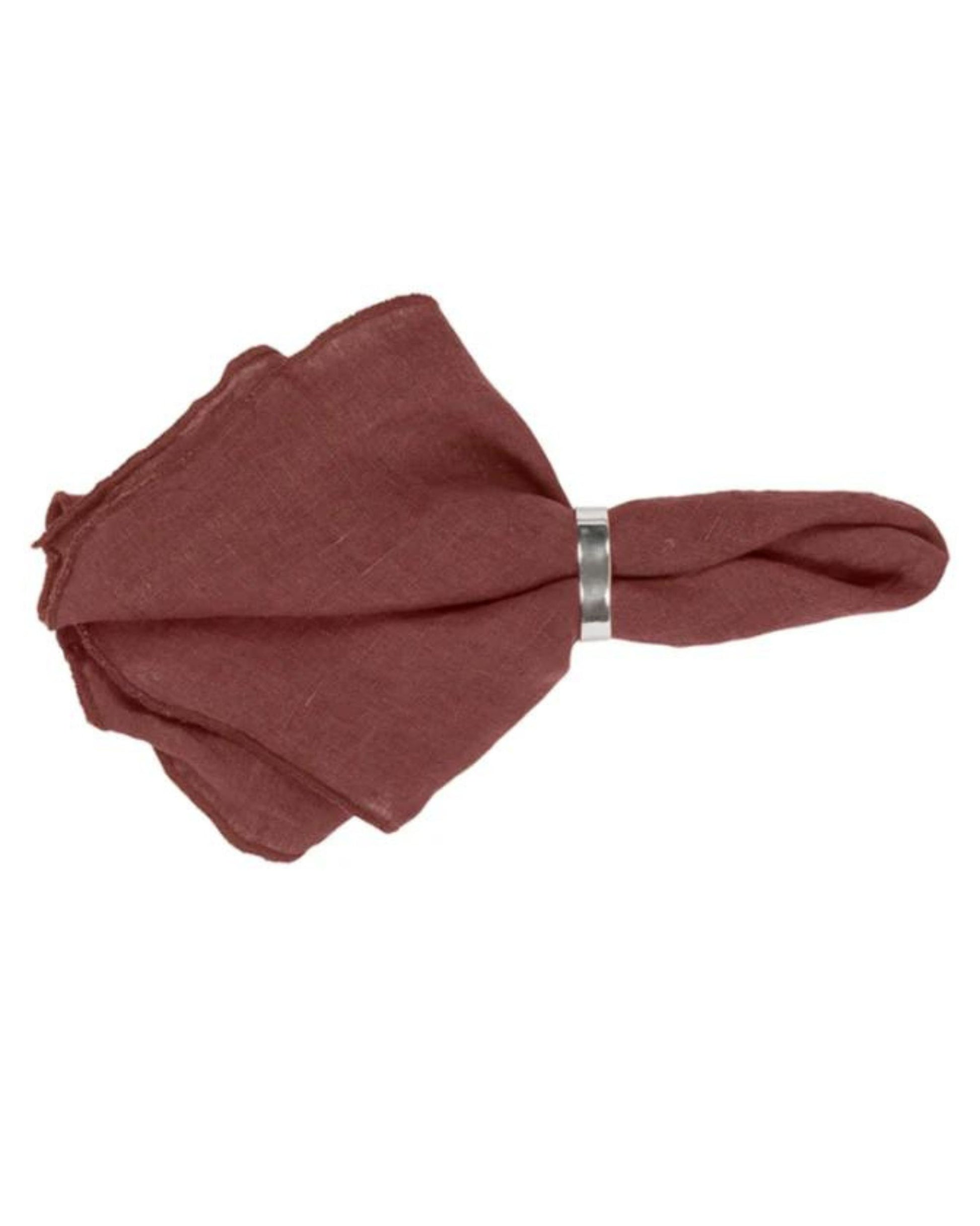 A folded maroon NAPKIN GRACIE ECO LINEN from Broste, secured with a silver napkin ring, is elegantly showcased against a plain white background. Made of eco-friendly materials, it brings a touch of sophistication to any setting.
