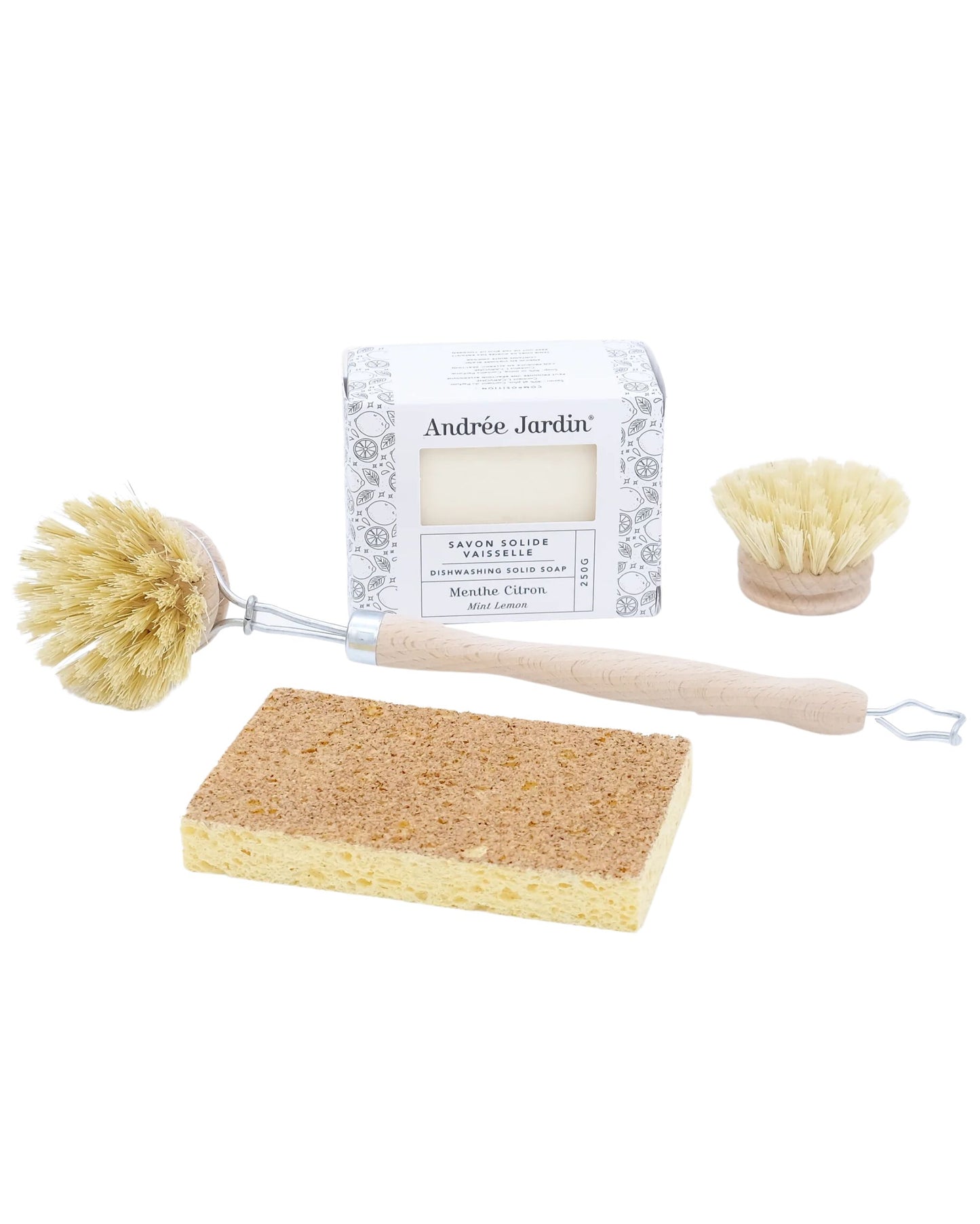 Introducing the DISHWASHING GIFT SET by Andree Jardin, a sustainable cleaning collection featuring reusable items. This set includes a natural bristle dish brush with a wooden handle, a block of Marseille soap in an elegant decorative box, a small round brush, and a yellow sponge, all beautifully arranged on a pristine white background.