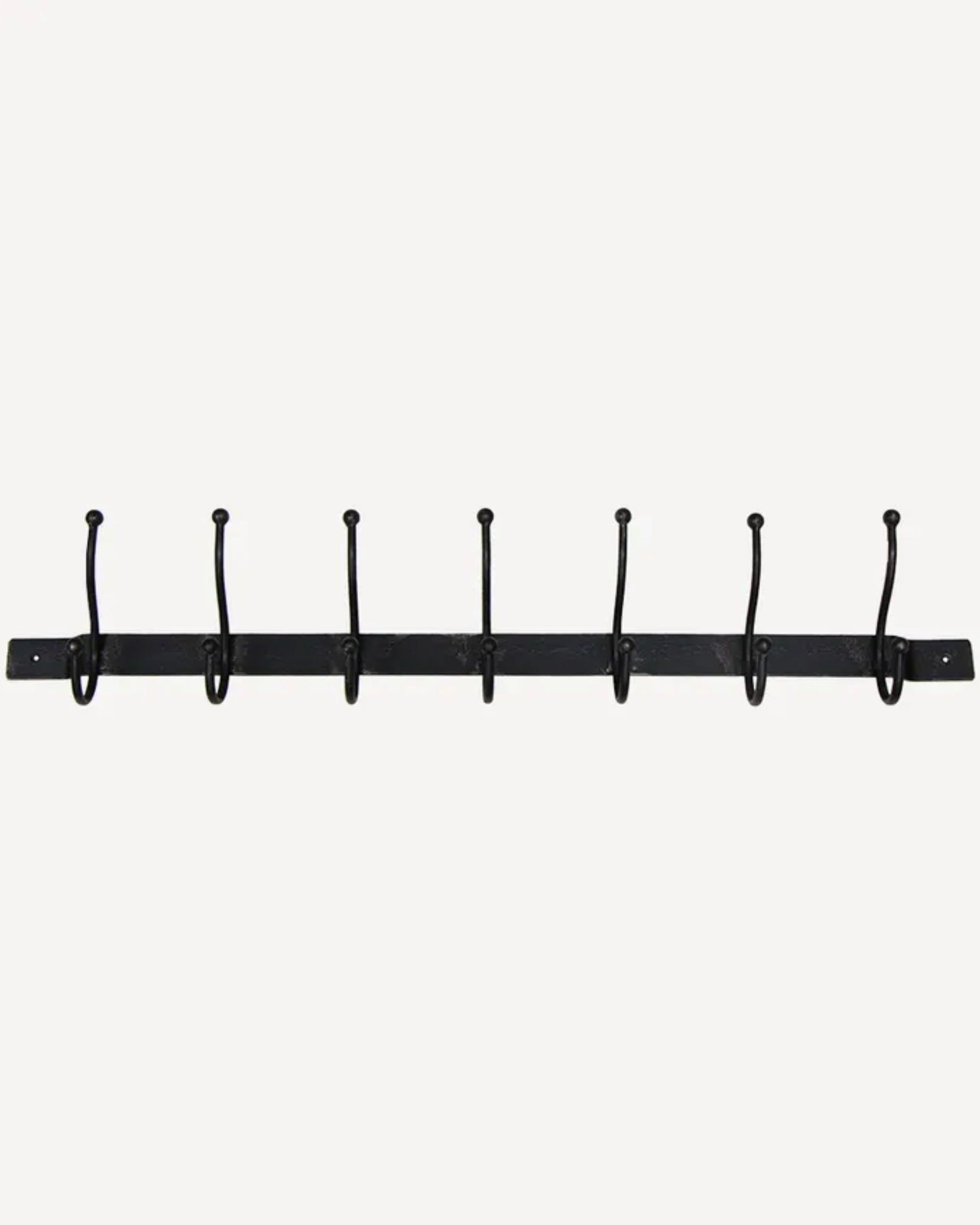 The French Country OLD METAL 7 HOOK BAR, designed for indoor use, is a sleek black metal coat rack featuring seven evenly spaced wall hooks mounted on a horizontal bar against a plain white background.