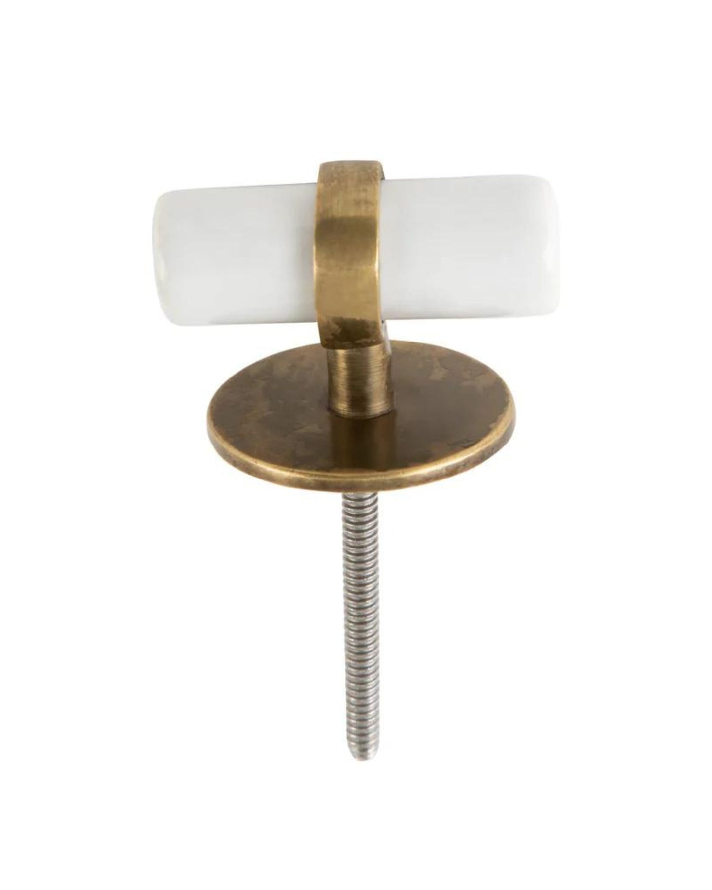 The TROUVE CERAMIC BRASS PULL by Society Ink features a cylindrical white porcelain cabinet knob framed by aged brass hardware, sitting gracefully on a round brass base. It includes a metallic screw for attachment, offering a design that is simple and elegant, reminiscent of classic ceramic brass pulls.