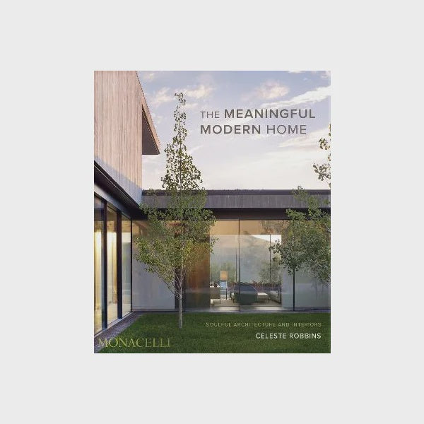 Cover of "THE MEANINGFUL MODERN HOME - CELESTE ROBBINS" by Nation Wide Books, featuring contemporary homes with expansive glass windows and a minimalist design. Set amidst trees under a cloudy sky, this modern masterpiece captures the essence of modern architecture.