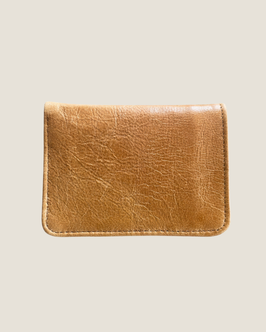 A genuine LEATHER WALLET by The Workroom, with its character-rich creases, hand made, genuine tan leather