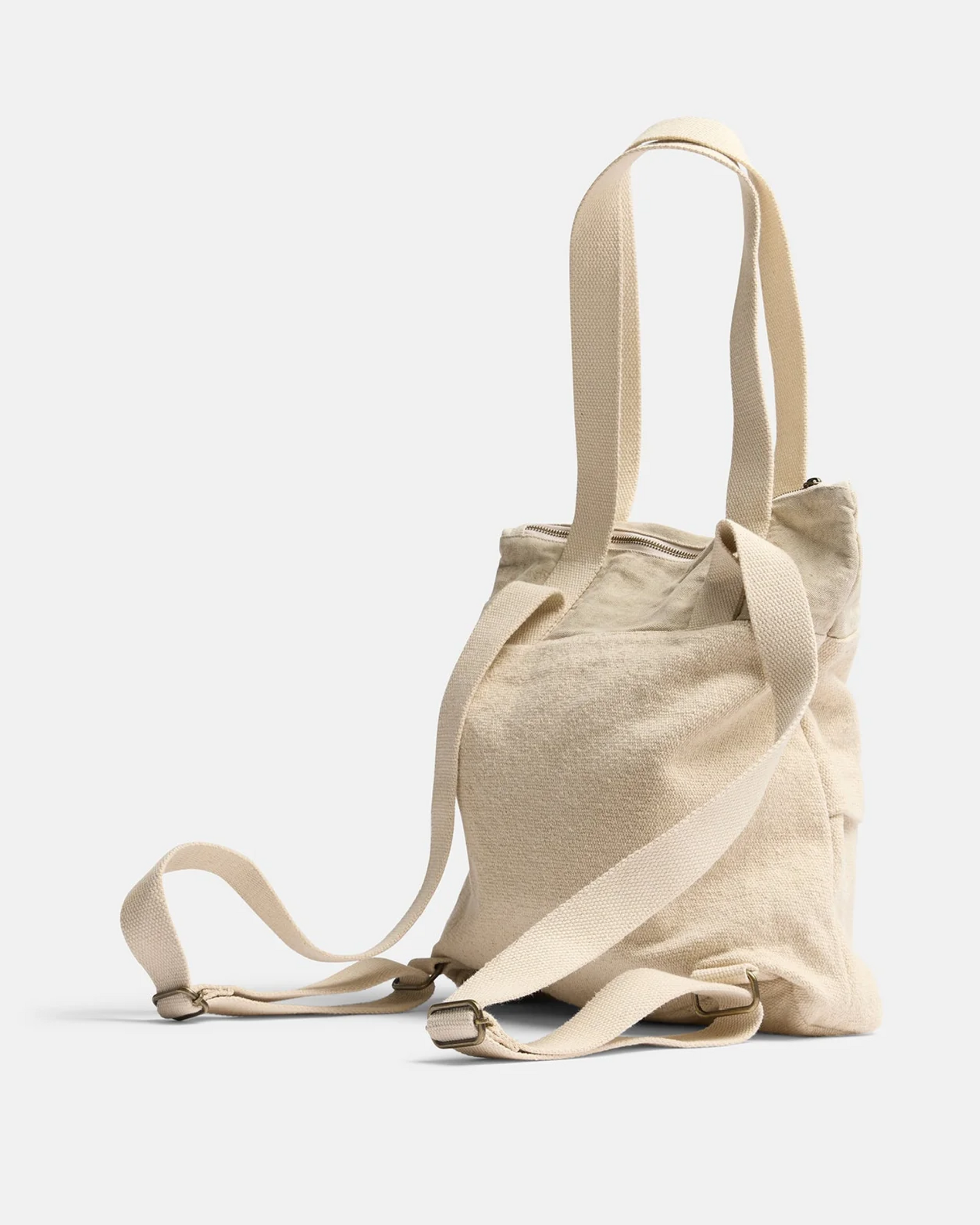 The ADVENTURE BACKPACK - NATURAL by Pony Rider is crafted in India from upcycled truck canvas. It boasts a beige design with adjustable shoulder straps, and its soft fabric and casual style make it ideal for everyday use in any setting.