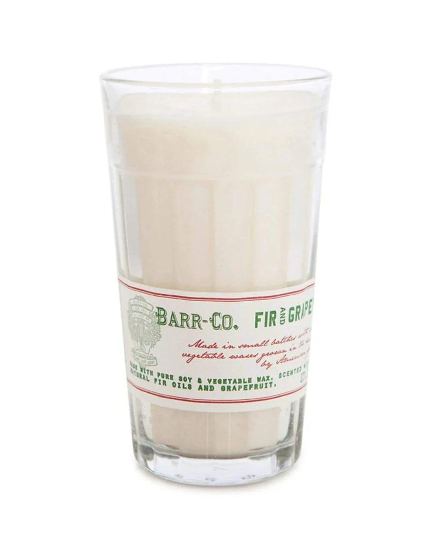 The BARR CO MILK GLASS CANDLE by Barr Co emits a festive spruce aroma, combining natural fir oil with grapefruit. It boasts a creamy white color and is made from pure soy and vegetable waxes, providing a warm and inviting atmosphere.