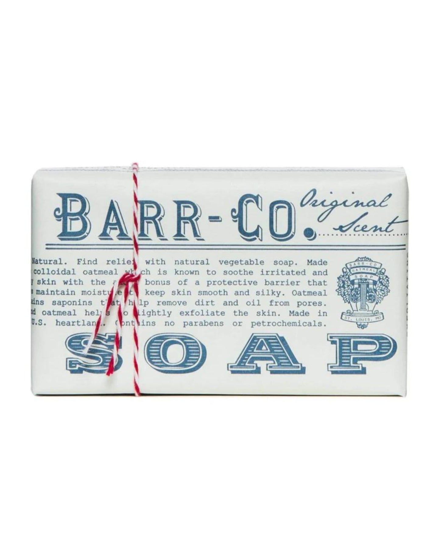 A BARR CO WRAPPED SOAP comes as a rectangular bar featuring a wrapper with blue writing that emphasizes the natural ingredients and benefits. It gently exfoliates skin, and the packaging, enhanced by a red and white string, adds an elegant touch to its signature scent.