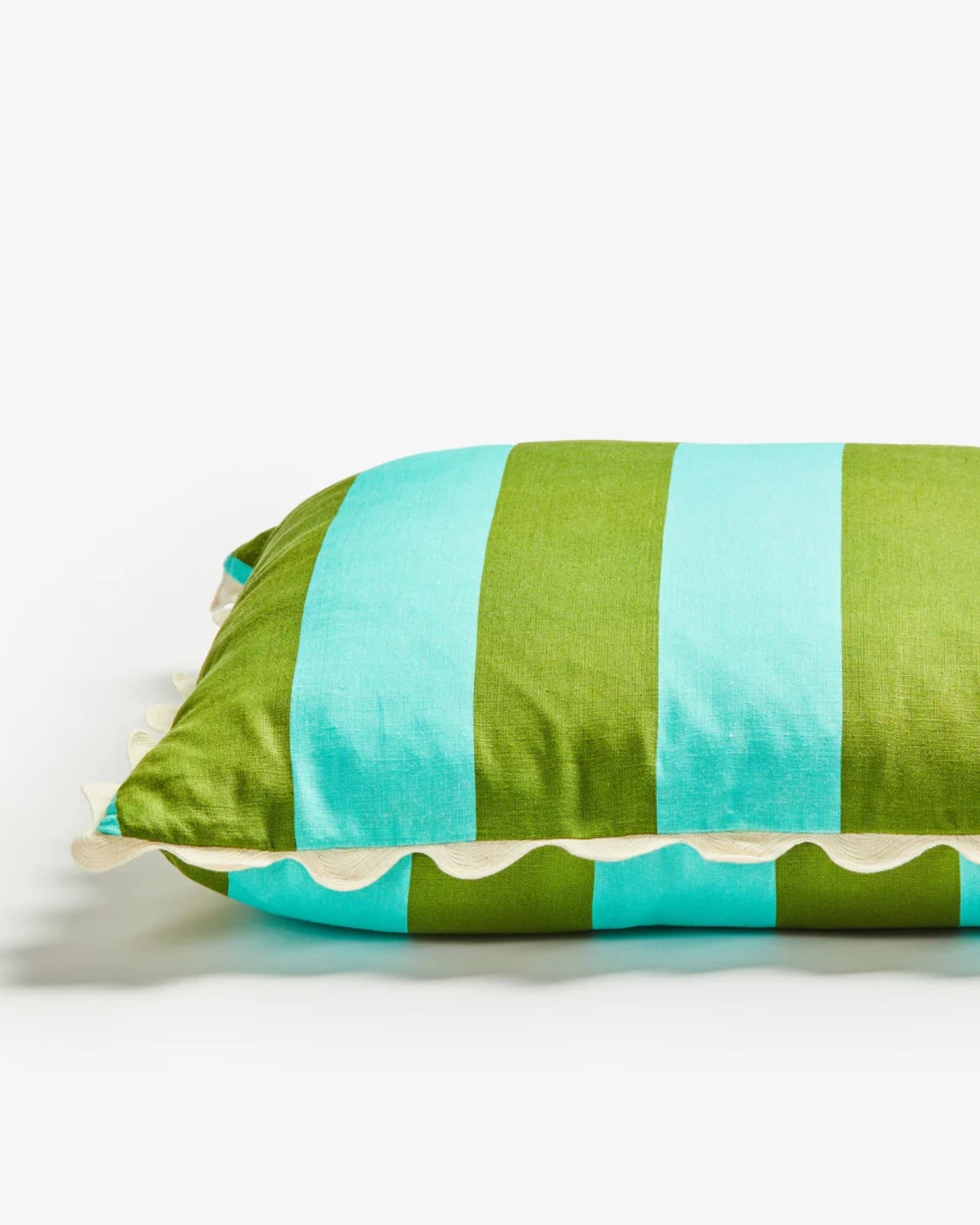 The BIG STRIPE CUSHION - MINT from Bonnie and Neil is crafted from soft French flax linen and features bold green and light blue vertical stripes. Its ruffled cream edges add a sophisticated touch, making it an ideal complement to your home decor against a plain white background.