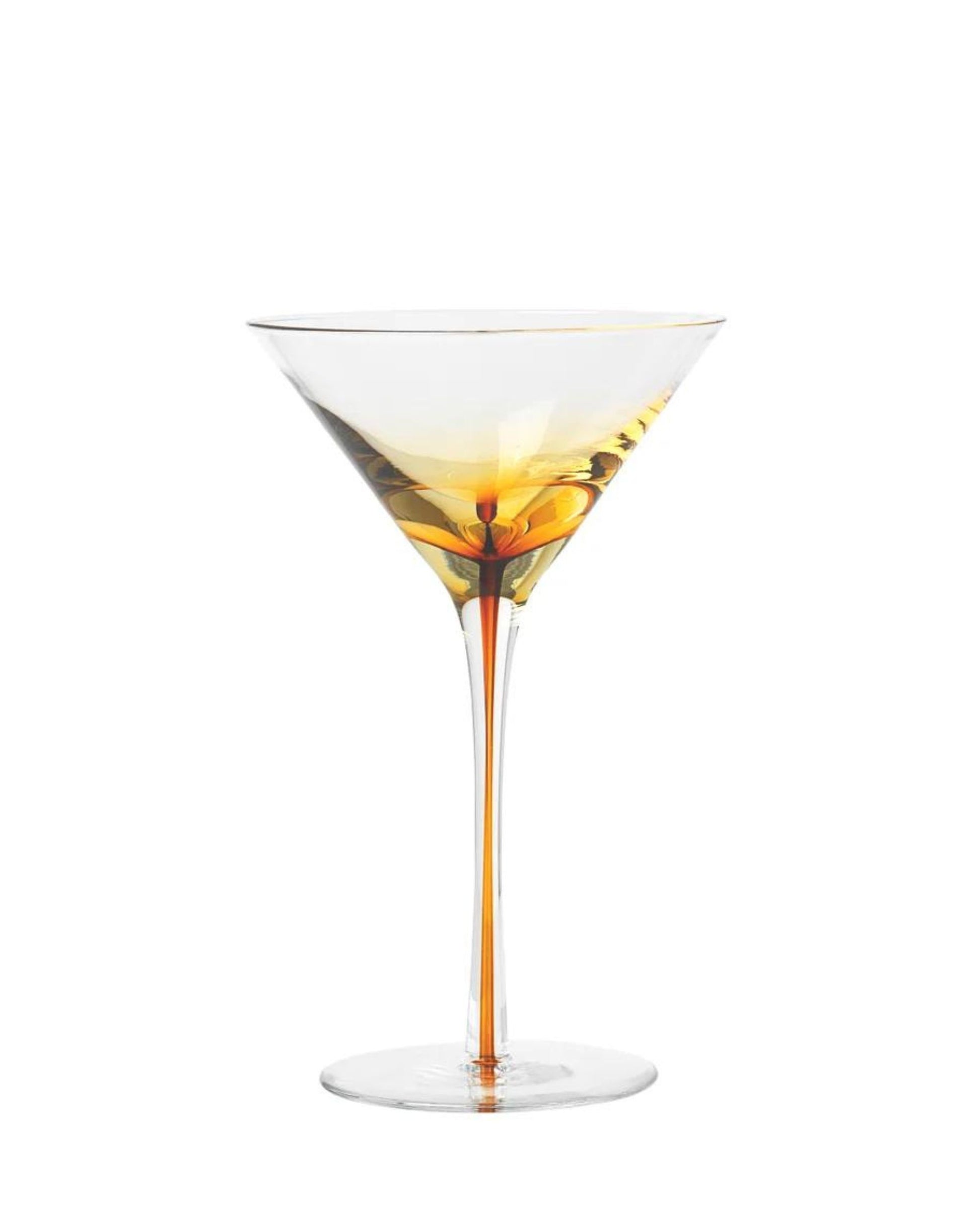 A MARTINI GLASS from Broste, crafted with their signature smoke glassware, holds an amber-colored liquid, possibly a cocktail. This handmade piece stands elegantly against a plain white background.