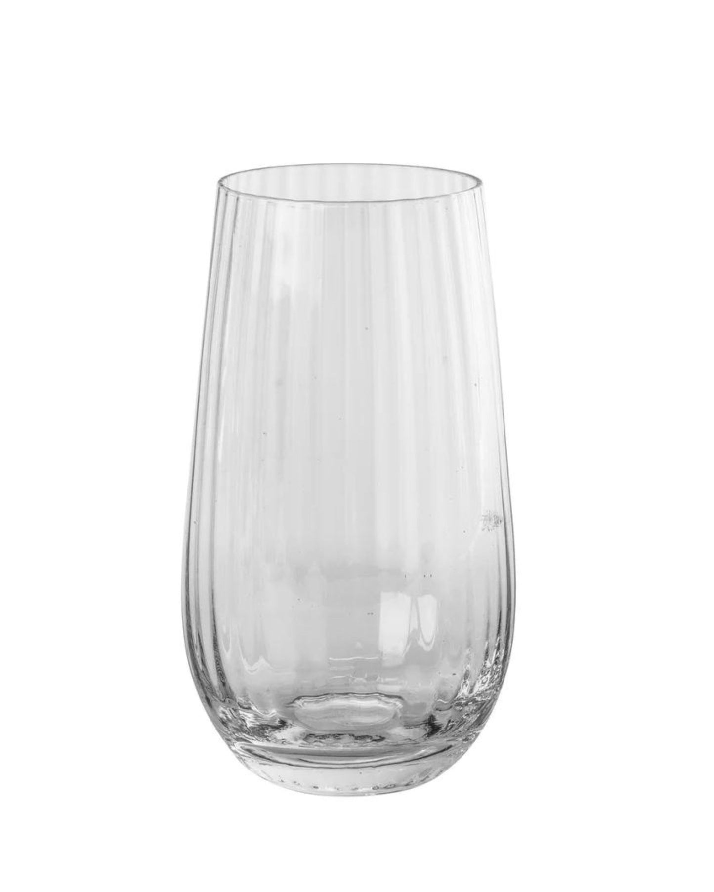 A tall, clear SANDVIG TALL TUMBLER from Broste, featuring a subtle vertical ridged pattern on its surface, is set against a plain white background.