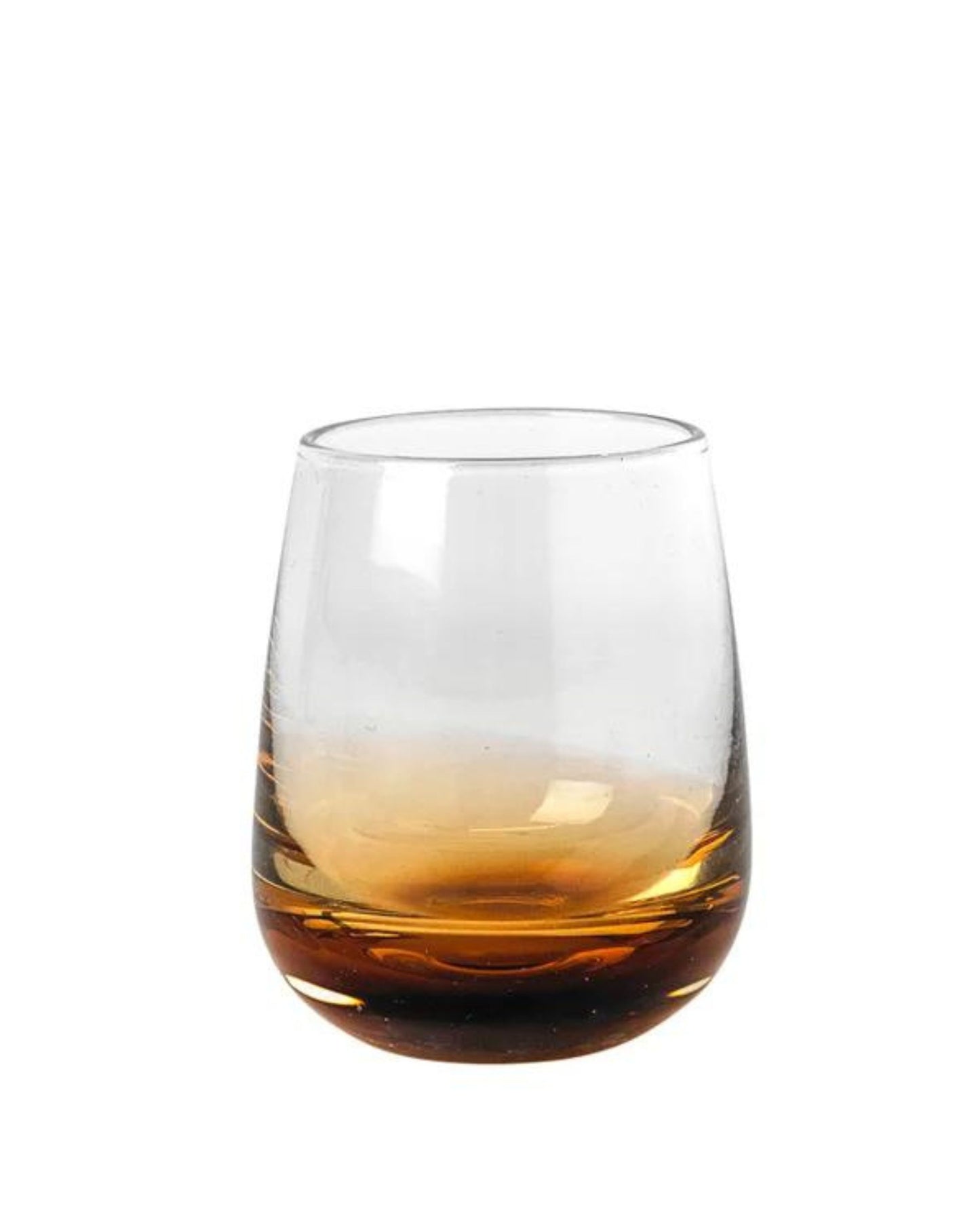 The Broste SHOT GLASS, partially filled with a brown liquid, exudes elegance with its clear design and wide base. Its minimalist style echoes Nordic nature against a plain white background.