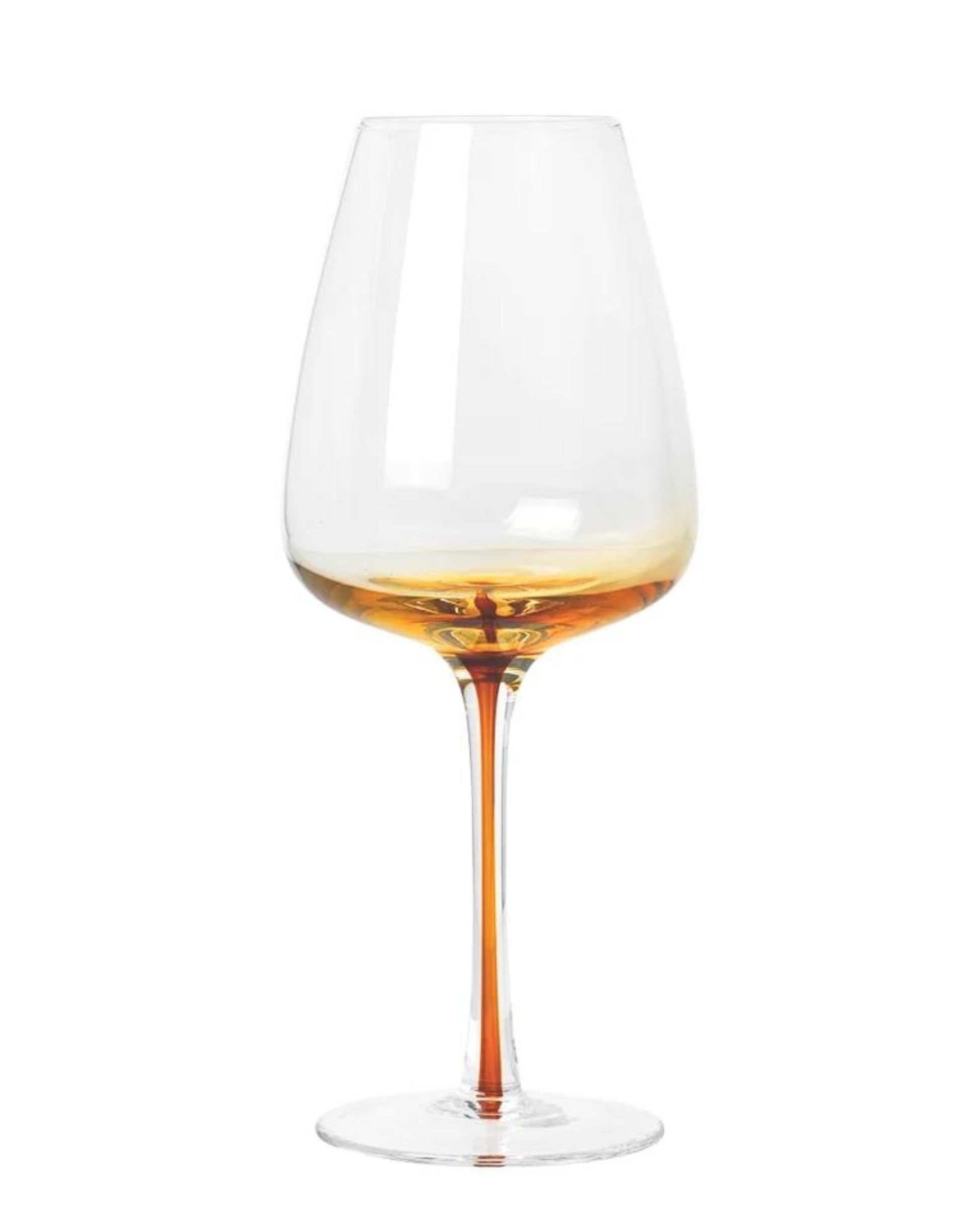 A Broste WHITE WINE GLASS, holding a small amount of amber-colored liquid and set against a plain white background, showcases the elegance of fine dining with its intricate detailing.