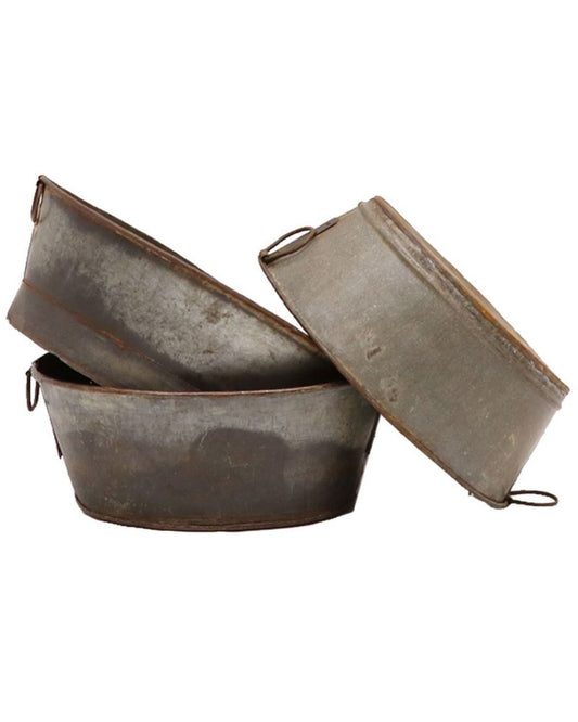 Three Hawthorne FLINT METAL LAUNDRY TUBs, with a vintage, oval-shaped design and crafted from recycled metal, are stacked on top of each other against a plain white background. They exude a rustic appearance with visible wear and include small side handles.