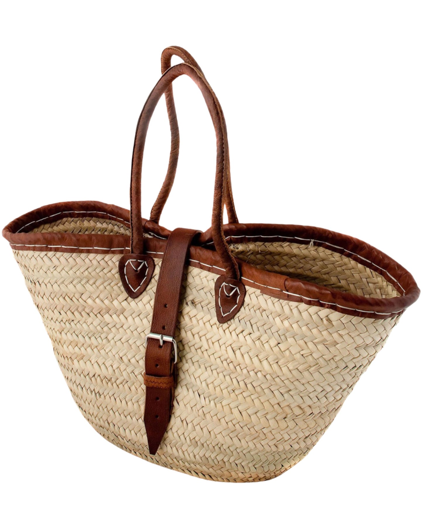 Introducing the FRENCH MARKET BASKET WITH BUCKLE by Epicure Trader—a distinctive woven straw tote crafted from hand-woven palm fronds. It features elegant brown leather handles and a leather strap with a buckle. Its wide, open-top design and light natural color capture the essence of traditional handmade Moroccan baskets.