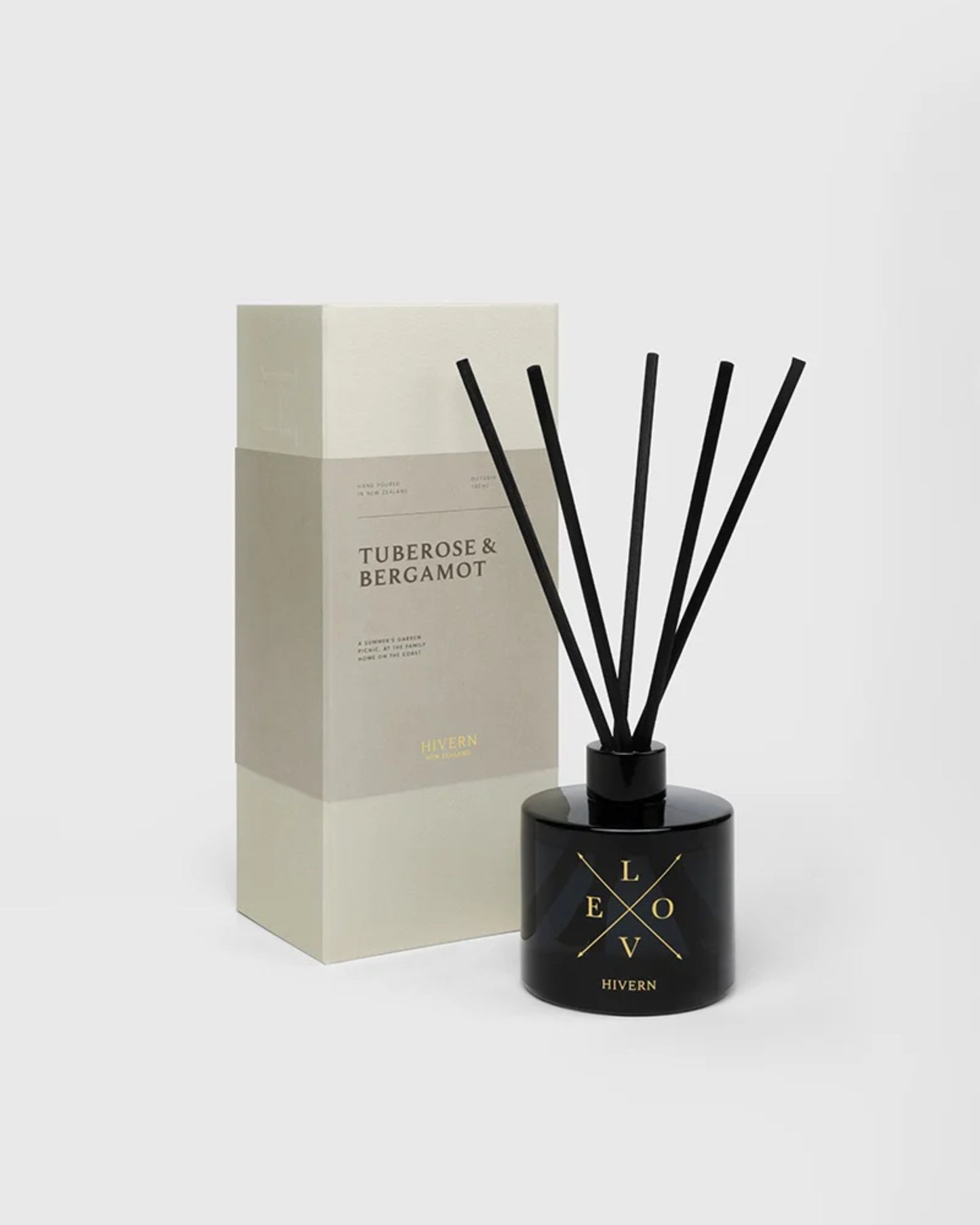 The image features the HIVERN DIFFUSER by Hivern, a Tuberose & Bergamot fragrance set. A sleek black diffuser bottle with silk fiber reeds is positioned in front of its matching rectangular box, designed for optimal scent dispersion, all set against a plain white background.