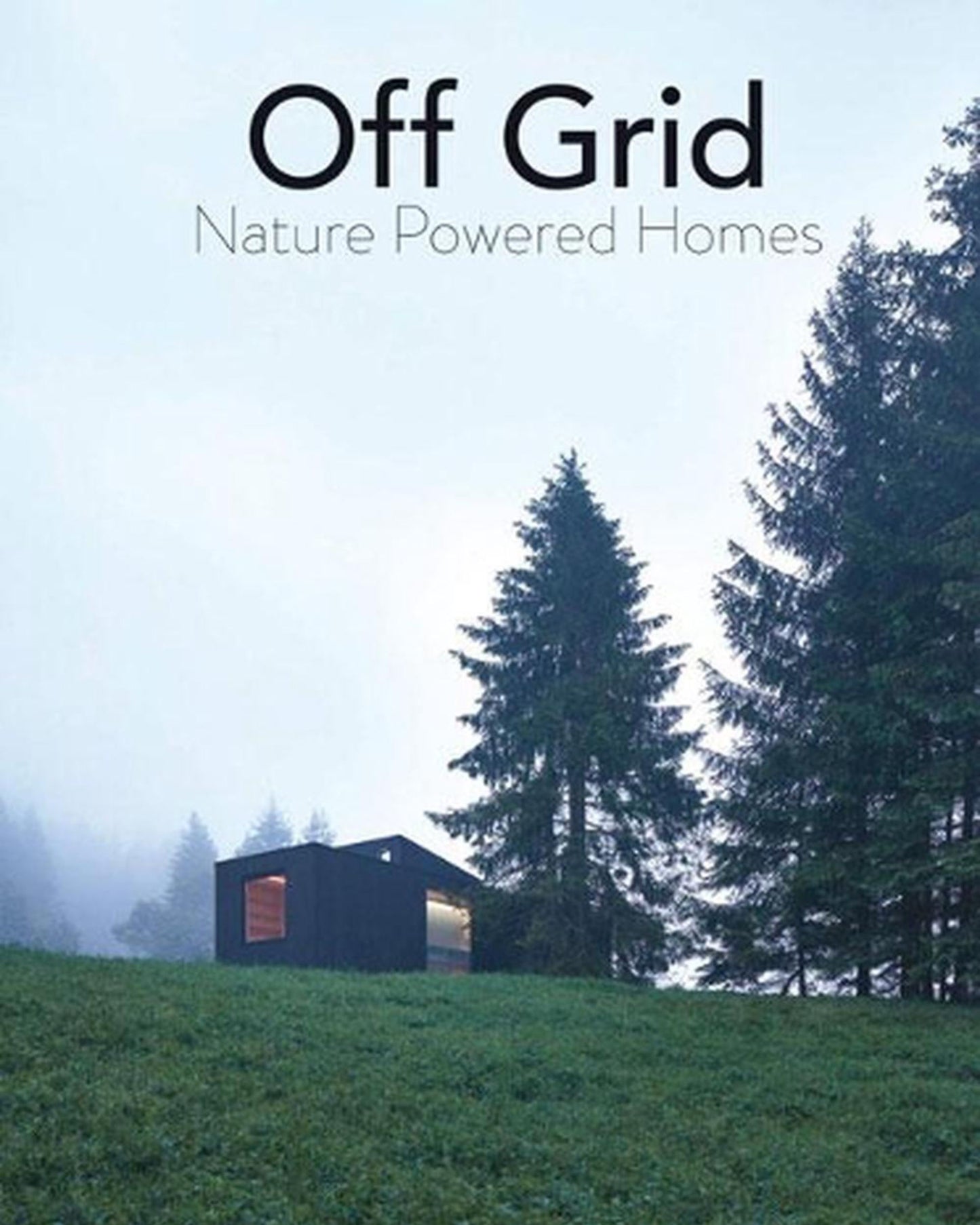 A cozy, contemporary cabin rests on a lush hillside, encircled by towering evergreen trees. A misty fog blankets the landscape, epitomizing the spirit of off-the-grid life. At the top, text reads OFF GRID - NATURE POWERED HOMES by Nation Wide Books.