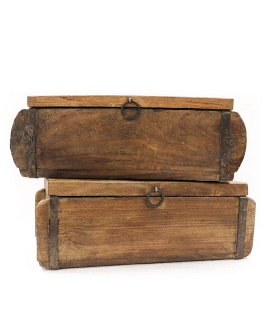 Two handcrafted wooden BRICK MOULDS WITH LID from Hawthorne stacked on top of each other, each featuring a metal ring handle on the front. The weathered wood provides a vintage appearance. These unique items are rectangular with rounded ends and reinforced with metal accents.