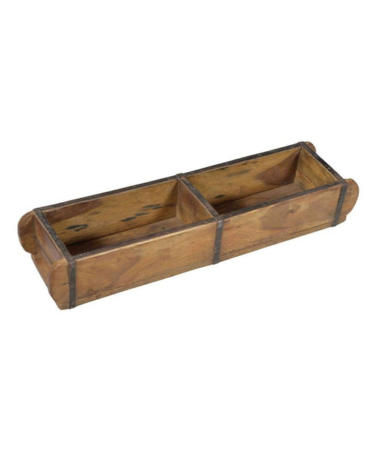 Introducing the DOUBLE BRICK MOULD by Hawthorne: a rustic creation crafted using traditional techniques and vintage moulds. This dual-compartment wooden trough showcases a weathered finish, reinforced with metal bands. Its rectangular shape and rounded edges highlight its truly handcrafted, timeless charm.