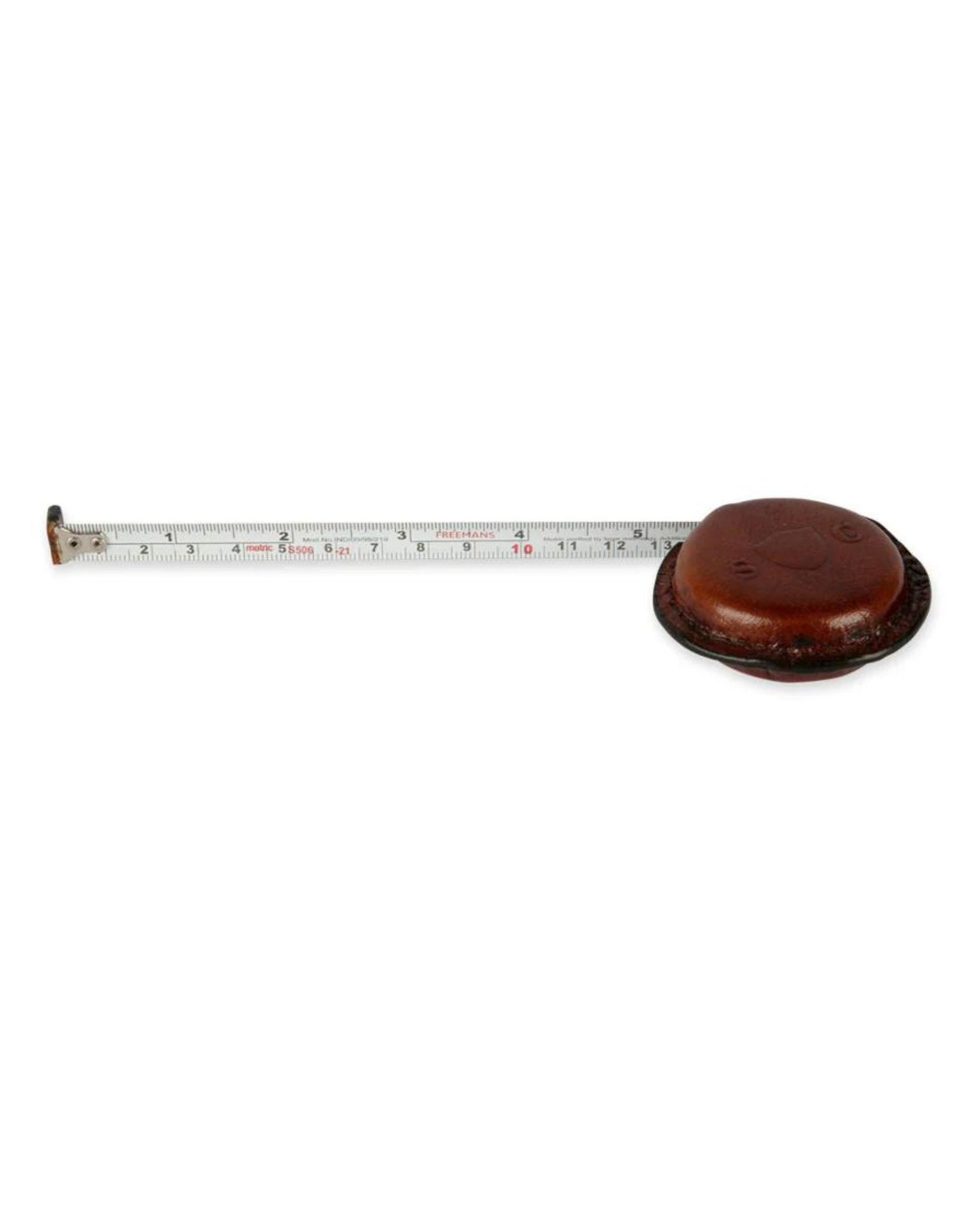 The PATTERNMAKER TAPE MEASURE by Society Ink, featuring a retractable design with measurements in both centimeters and inches, is partially extended from its round, leather-covered casing. Perfect for the vintage shopper, it gracefully rests on a white background.