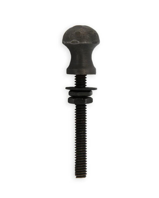The PERIWINKLE DRAWER KNOB, offered by Society Ink, is a blackened steel knob with a round head and threaded shaft that includes two washers on the shaft. It is presented against a plain white background, making it an ideal choice for creating unique drawer pulls.