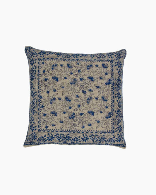 Introducing the SOFIA FLORAL AZURE CUSHION COVER by French Country – a square design featuring a beige background with an intricate blue floral and vine pattern that adds a delicate floral touch. Made from soft linen, the design gracefully covers the entire surface, accentuated by a matching decorative border along the edges.