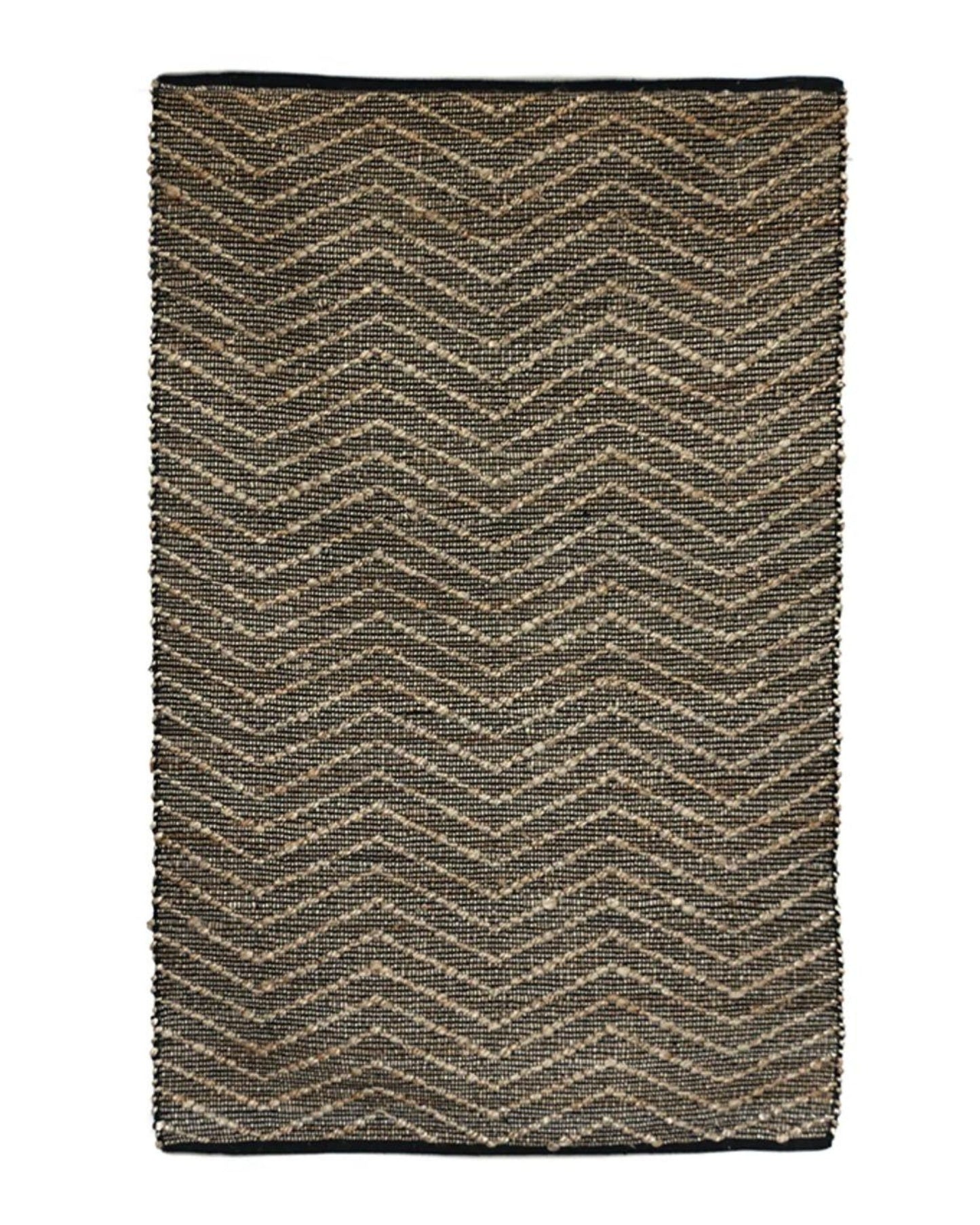 The ZIGGY JUTE/COTTON RUG by CC interiors is a rectangular piece featuring a chevron pattern in brown and black tones. This eco-friendly rug boasts neatly finished edges and showcases a coarse, natural texture.